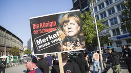 a demonstration organised under the motto Merkel must go