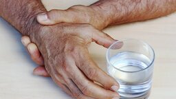 The hands of a man with Parkinson